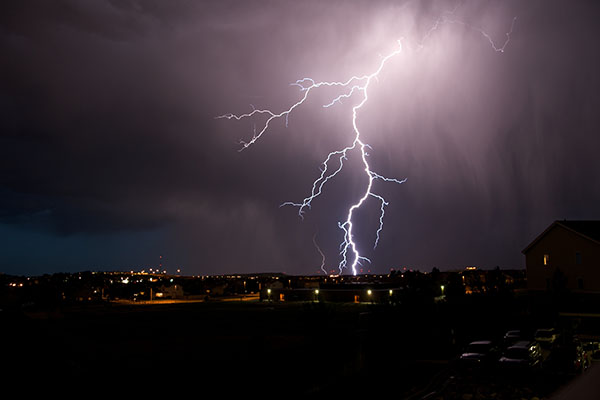 lightning-strikes-city-at-night-illuminating-the-sky-and-NG9-1-1-Network-still-working-through-storms