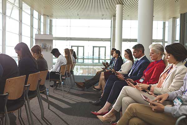 professional-first-responders-sitting-in-conference-hall-learning-about-ng911-processes-and-technology