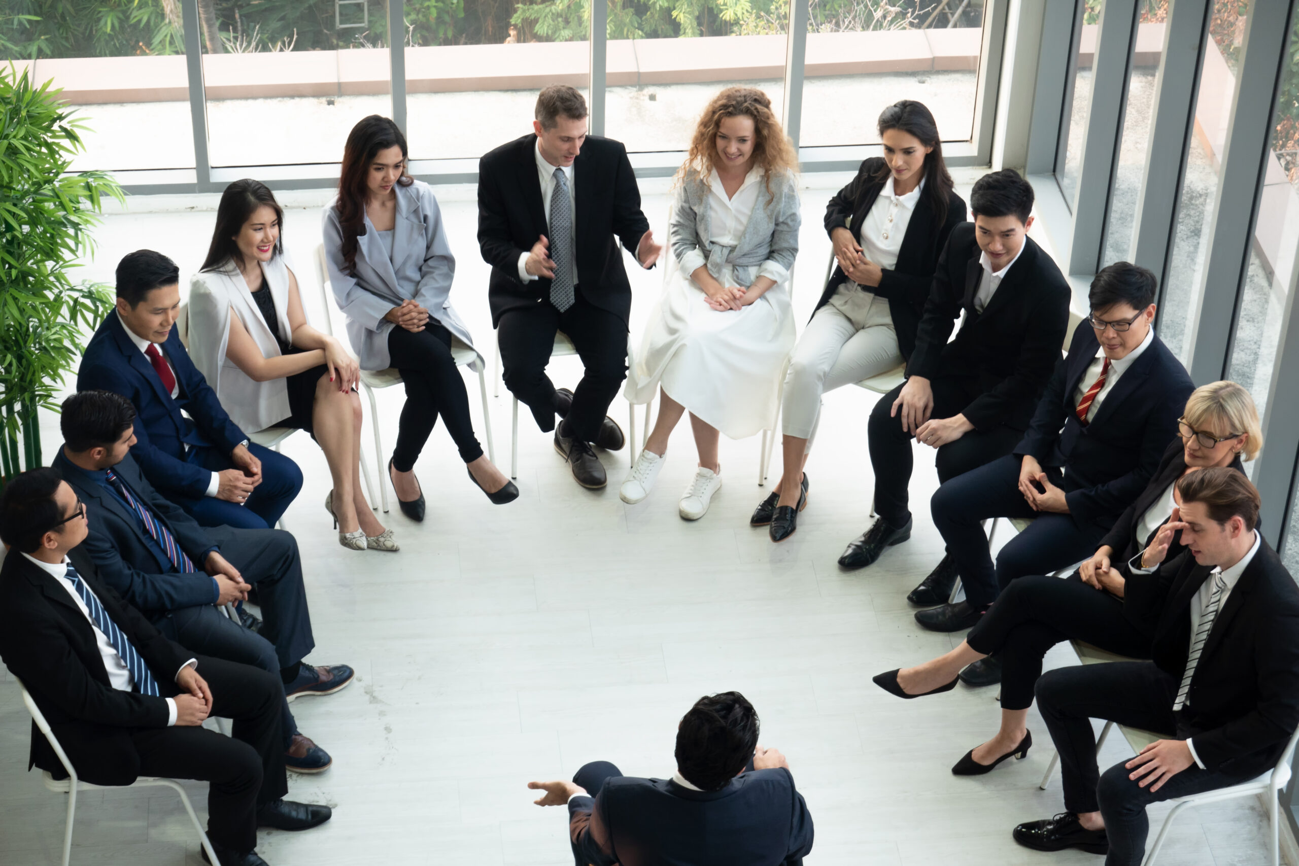 group-of-next-gen-911-professionals-discussing-policies-in-a-circle-to-improve-the-future-of-emergency-response-for-psaps-and-citizens